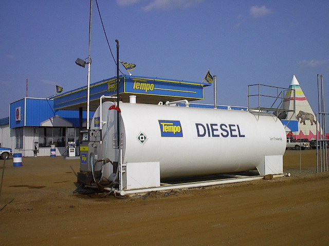 A diesel tank in front of a gas station.