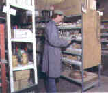 A man standing in a warehouse.